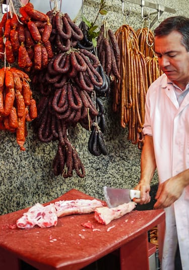 butcher chopping meat bolhao market porto