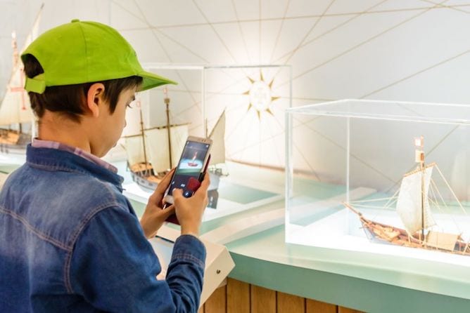 boy photographing miniature boat world discoveries porto