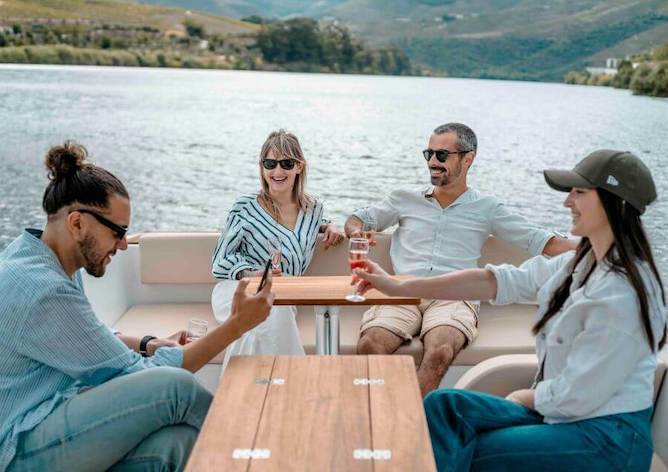 friends drinking wine boat
