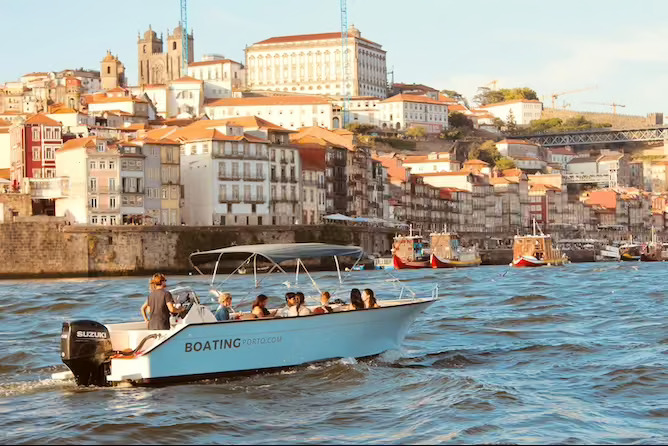small boat cruise porto sunset