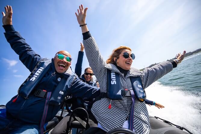 couple enjoying speedboat