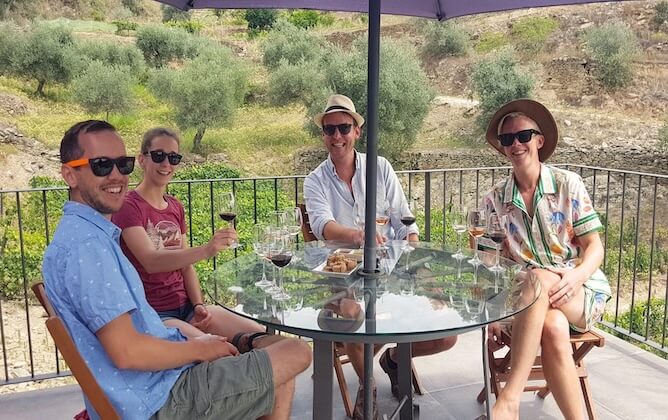 friends drinking wine terrace