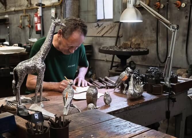 artisan making silver pieces